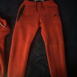 red nike tech pants