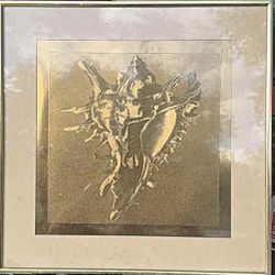 A modern framed embossed gold conch shell artwork.