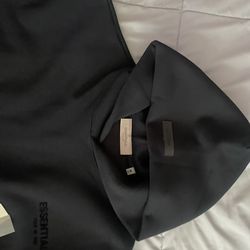 Selling black essential hoodie size Medium