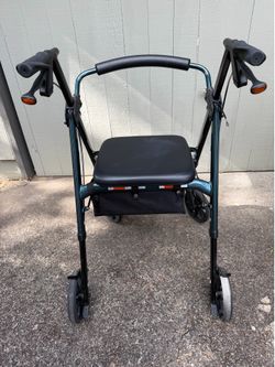 Four wheel walker with padded seat