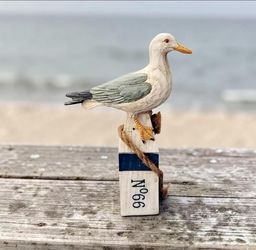 Beachcombers Seagull Perched On Top Weathered Buoy 6" Coast Decorative Figurine. This charming Beachcombers coastal decor figurine features a hand- pa