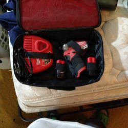 Milwaukee 12v Fuel Surge Impact W/ 2 Batteries and charger 