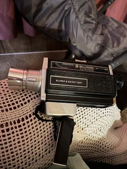 Bell & Howell movie camera & lamp 