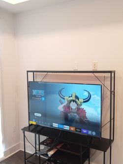 55 inch Amazon smart tv w/entertainment stand