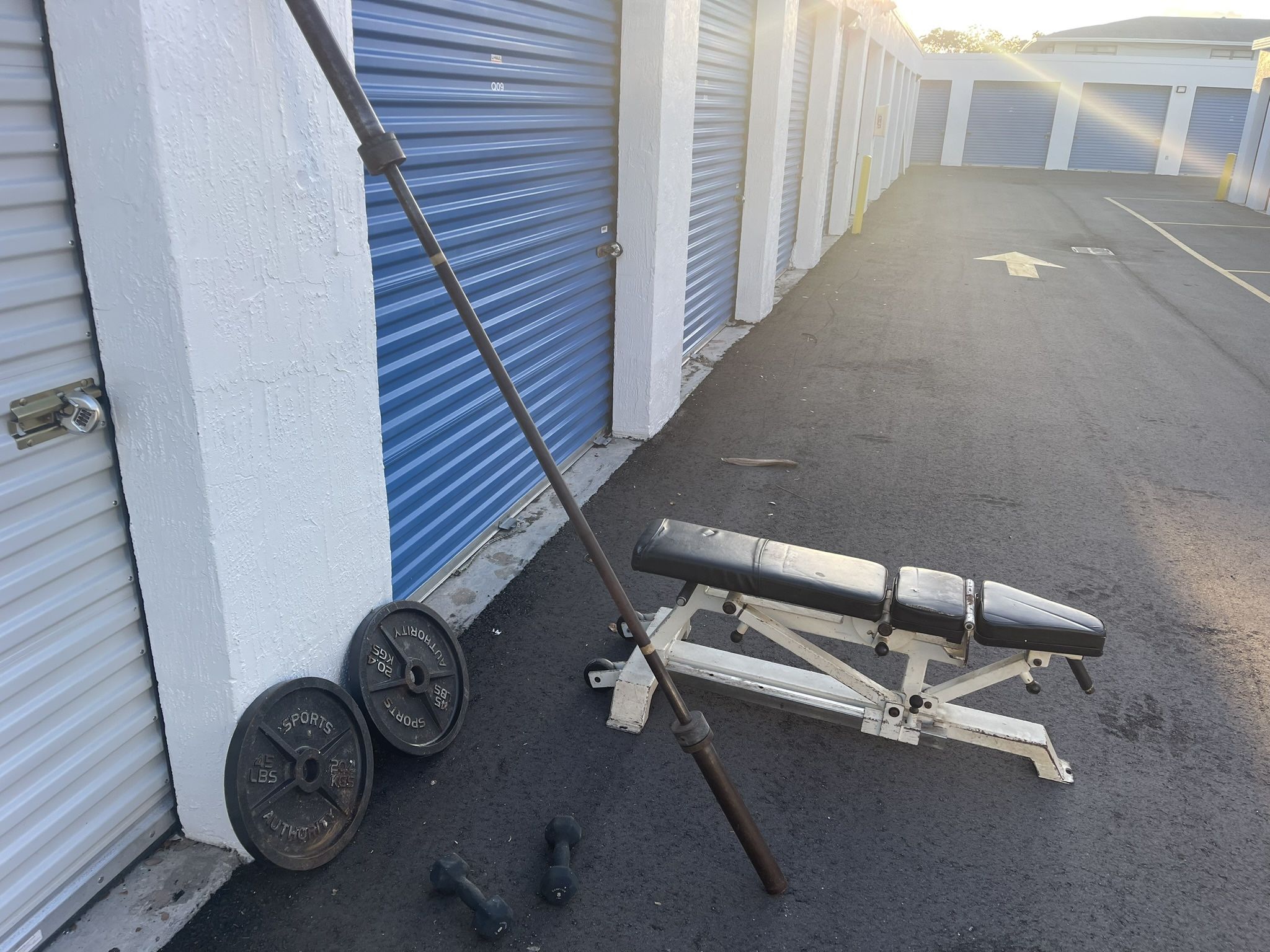 Weights and cage style squat, rack, bench press, lap pull down