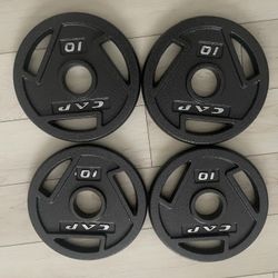 4 10lbs Weight Plates w/ 2” Holes Looking To Trade For 1” Hole Plates