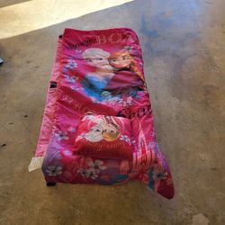 Travel cot with blanket