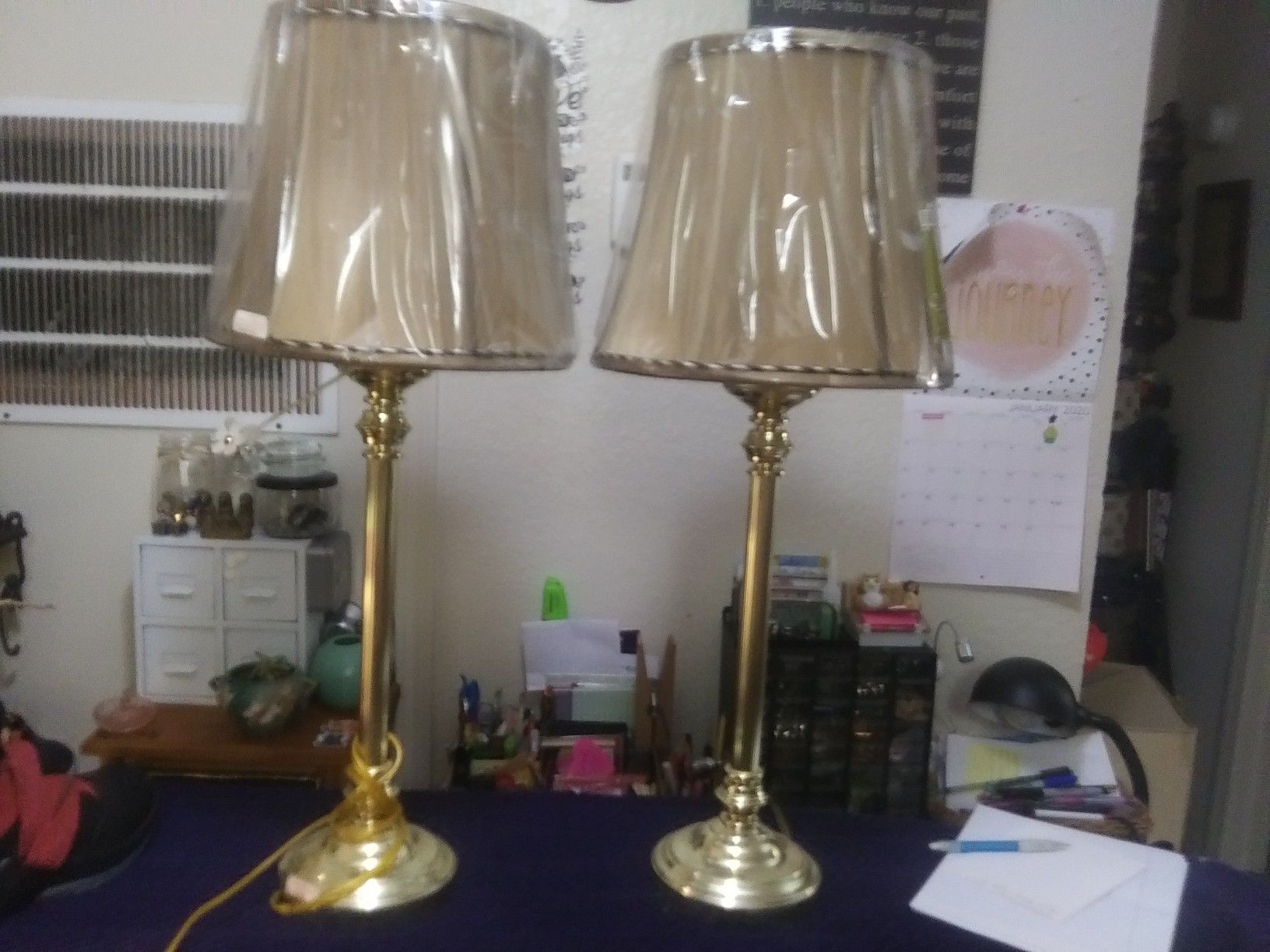 2 brass colored lamps