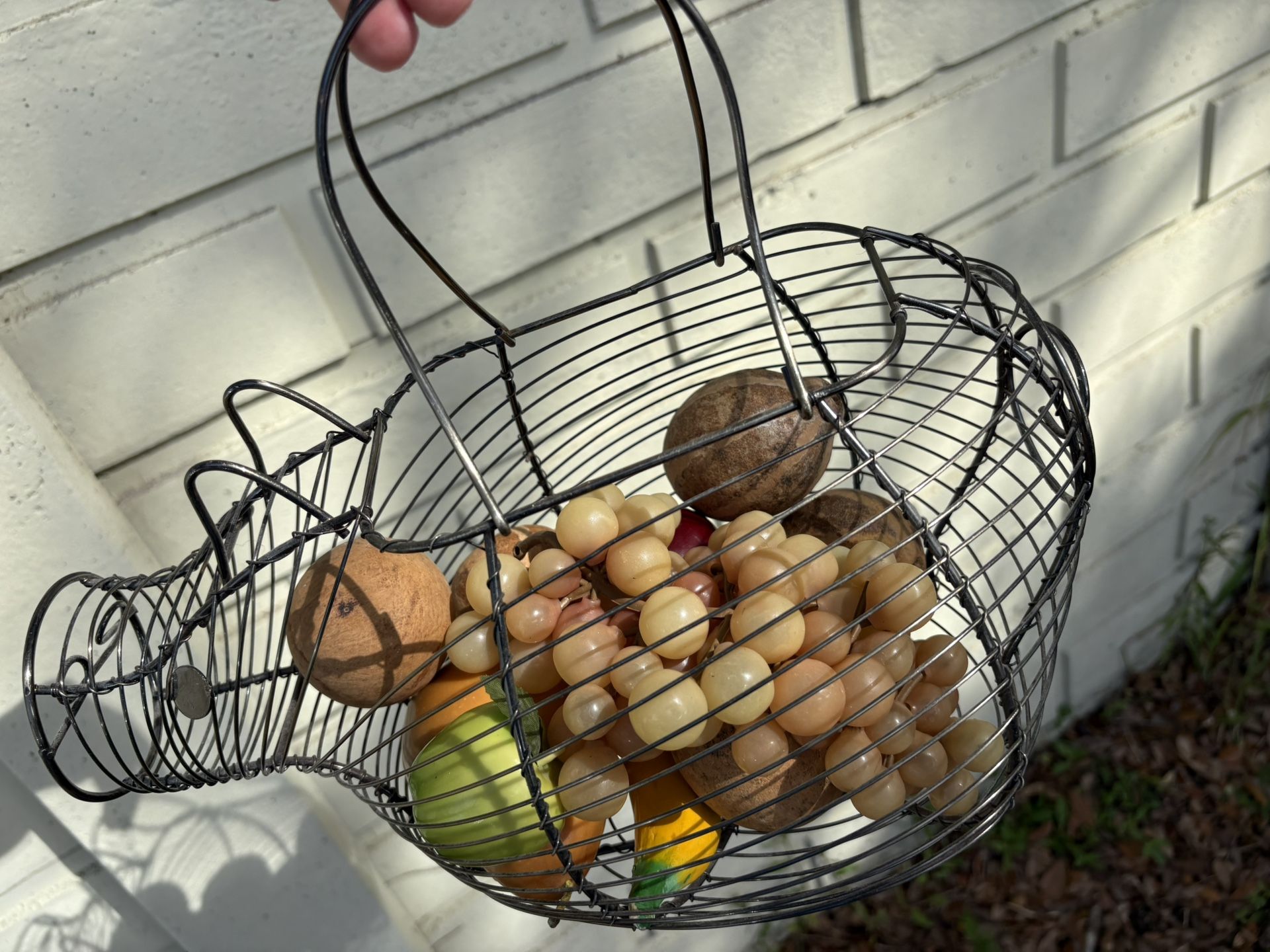 Metal hippo rhino basket. Fake fruit included. Nice for fresh apples, pears, oranges or napkins etc.