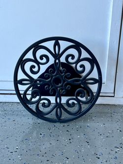 Decorative garden hose wall mount