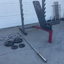 Weight Bench And Weights And Bar