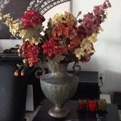 Vase with bouquet of silk flowers