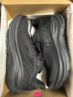 Brand new Hoka running shoes in black.