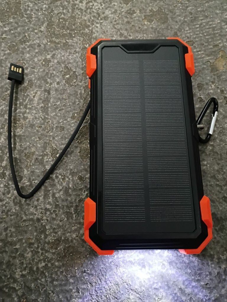 42,800 mAh Rugged Solar Portable Charger w Flashlight, Thermometer and Built In Charge Cables
