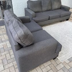 Sofa and loveseat in perfect condition.I can deliver for an additional cost.The price is $200. Dark gray color . 