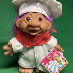 2006 Master Chef Troll doll with purple hair.