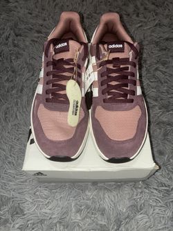 Size 9,5 men’s brand new unworn Adidas shoes with tags and box.