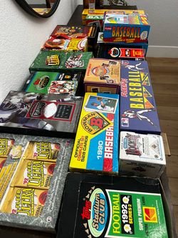 Sports card boxes and packs everything is sealed selling altogether baseball cards, football cards basketball