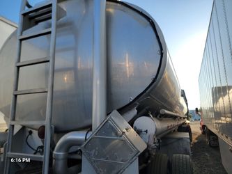 1996 heil  4 compartments  bth side loading
