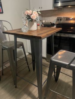 Bar height table with chairs