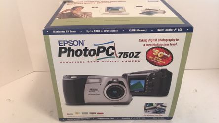New opened box Epson PhotoPC 750z like new comes w/ user manual, Getting Started Manual, 4 Rechargeable Batteries, charger, 2 Guides to digital camera