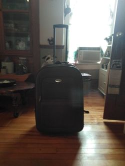 The suitcase is a  b i b o s s