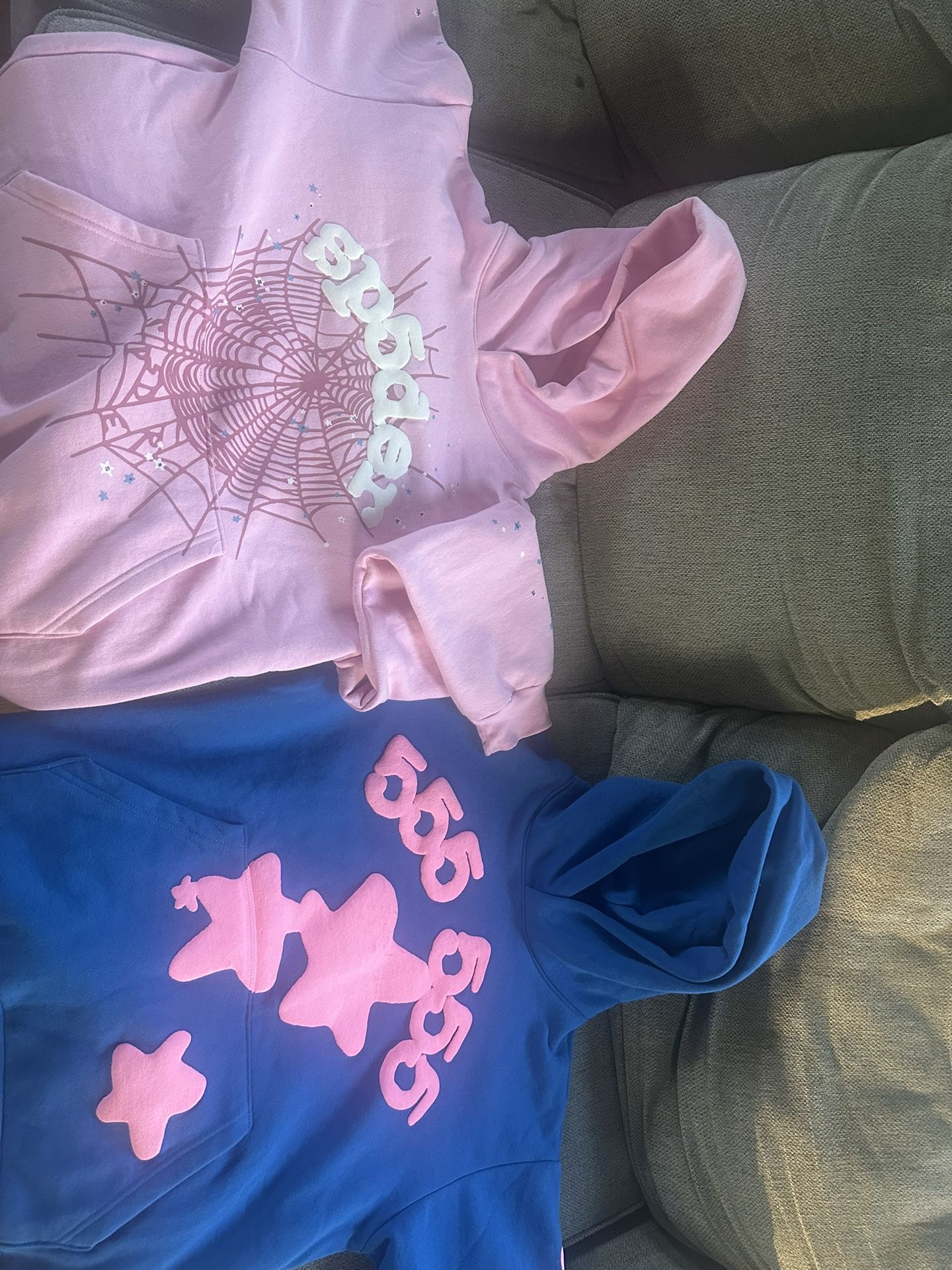 Large beluga blue sp5der hoodie. Large light pink sp5der hoodie.