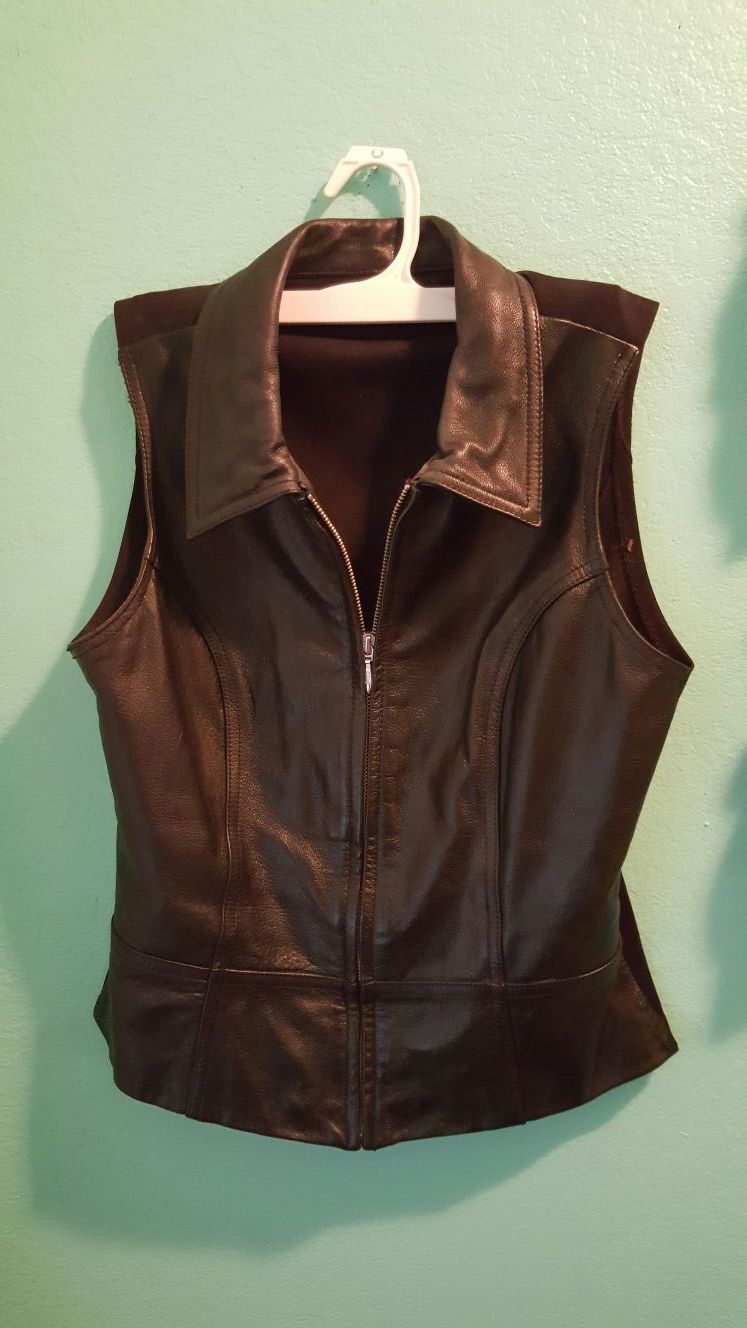 Black leather vest. ..size med womens. ..great for a motorcycle or just around...Great condition!