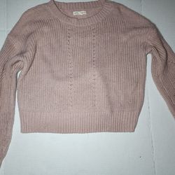 Aéropostale pink ribbed knit sweater with drop-shoulder sleeves.