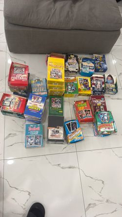 Sealed and opened boxes of sport card packs nfl mlb nhl nba