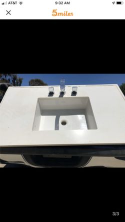 Sink with 4”backsplash, and faucet.