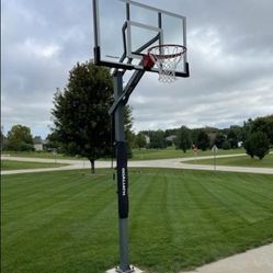 Goaliath 54 inch in ground basketball hoop, adjustable basketball court