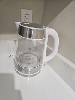 household items- electric kettle, glass floral containers,  bed risers, soap