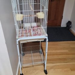 BIRD CAGE WITH STAND  HAS WHEELS TO ROLL DISHE TOO