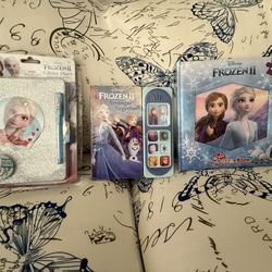 Brand new Frozen puzzle, diary, sound book