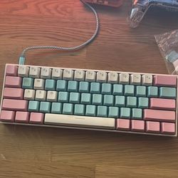 Anne Pro 2 keyboard with pink and blue keycaps | will come with original white ones