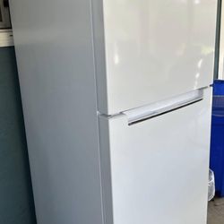 Selling a Magic Chef 14 months old white top-freezer refrigerator in good working condition. 