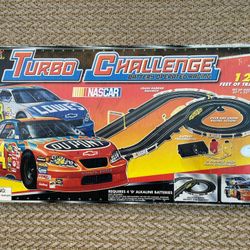NASCAR  Turbo Challenge battery operated slot car racing with 12 feet of track - batteries not included.  Sale Price Through Sunday, 2 Pm: