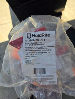 Plumbing fixture outlet holdrite