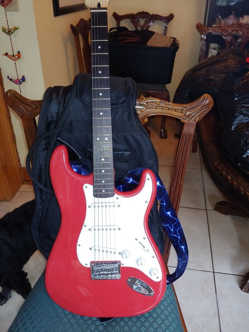 Fender Squier electric guitar with bag and tuner