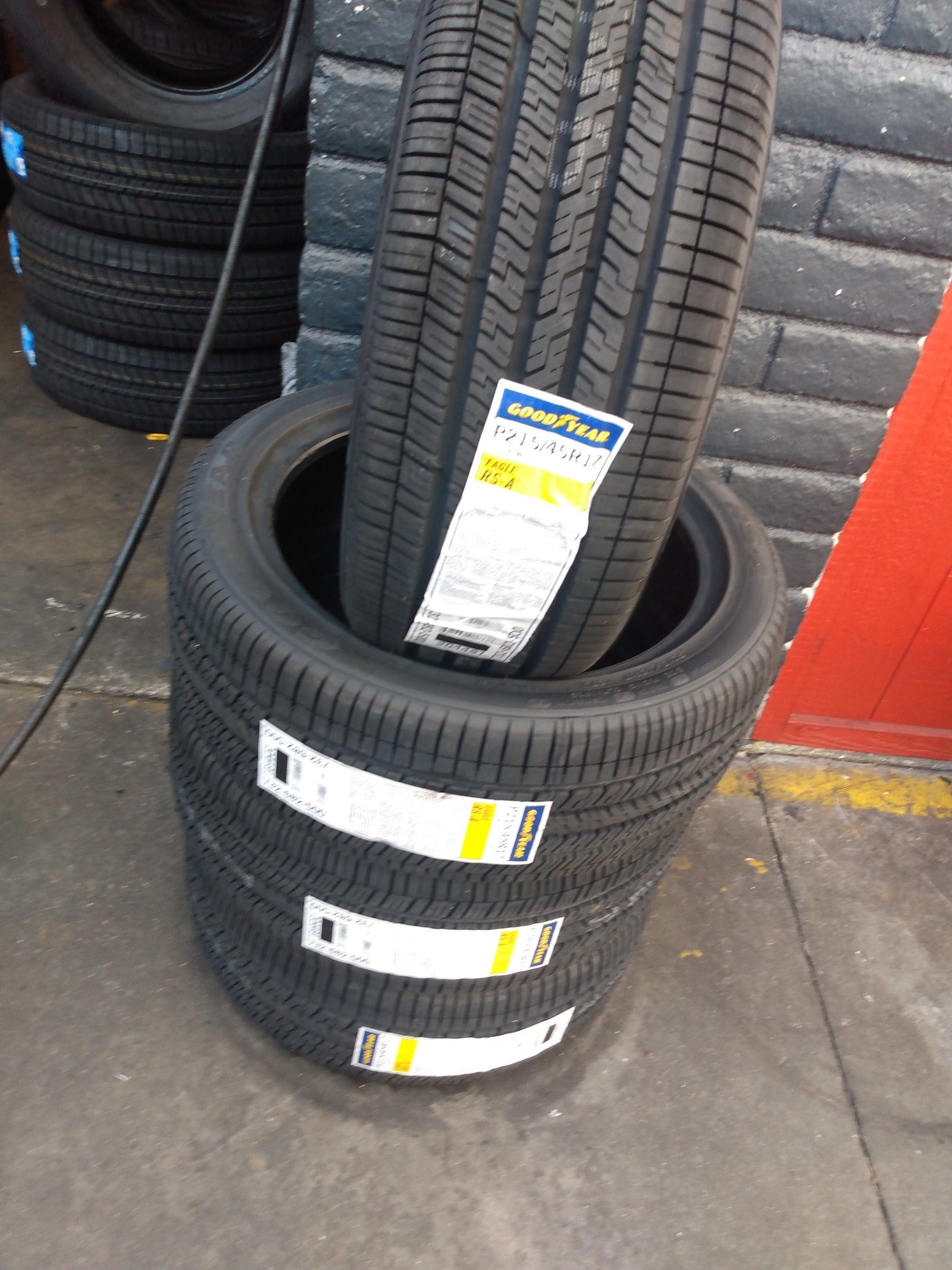 Set of new four tires Goodyear 215 45 17 free professional installation