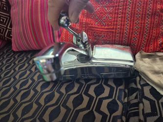 The highlighted object is a vintage Delta kitchen faucet escutcheon cover plate (often called a baseplate or deck plate), designed for classic faucets