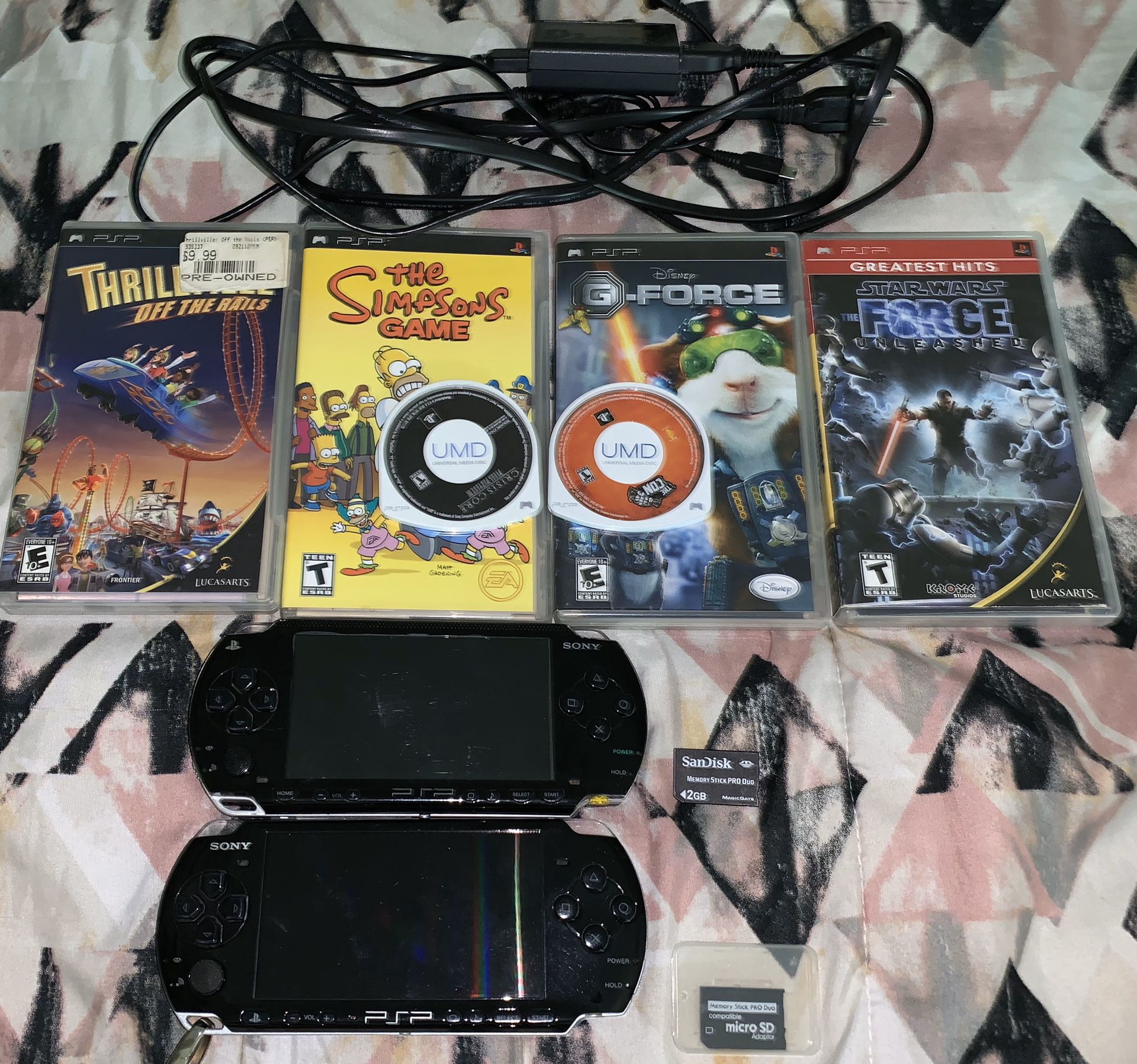 2 PSP’s w/ 6 games + charger + memory cards