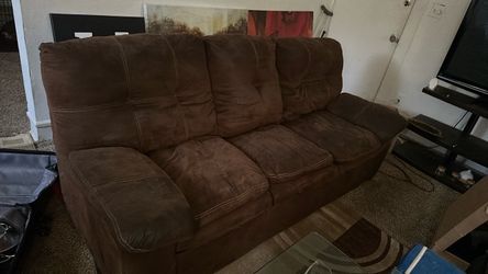 Brown suede couch and loveseat