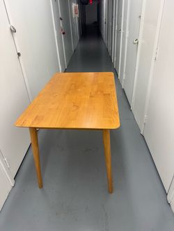 Wooden table and two chairs