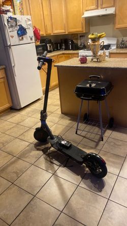 Folding Electric Scooter Black and Blue have a charger