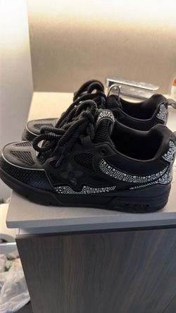 Black L V trainers