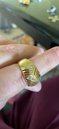 Gold colored ring with CZ gems