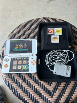 Nintendo 2DS XL. And 3 games bundle  Chargers and case