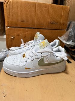 White and gold sneakers